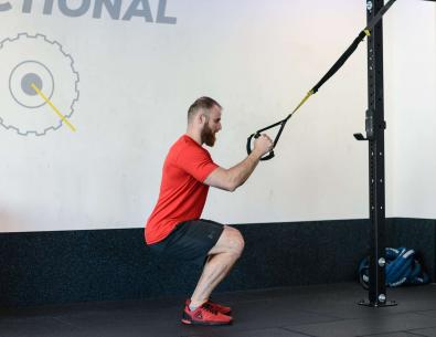 Squat with TRX